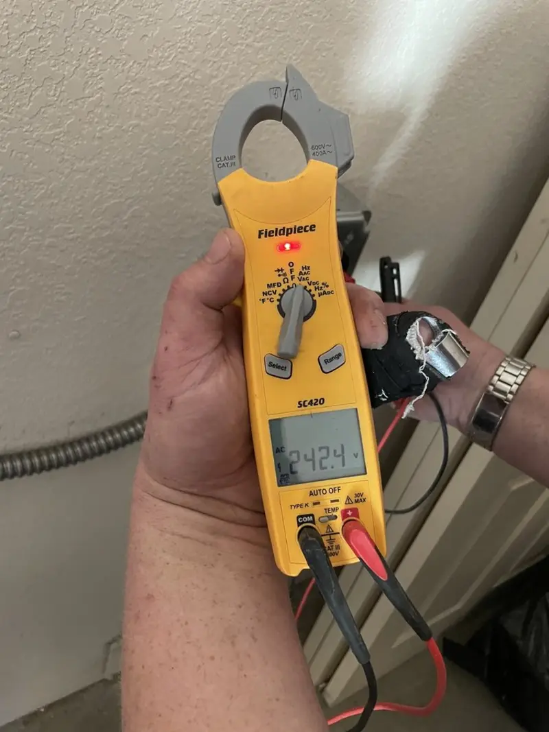 Voltage testing with clamp meter during Electrical Installation Services in DeSoto